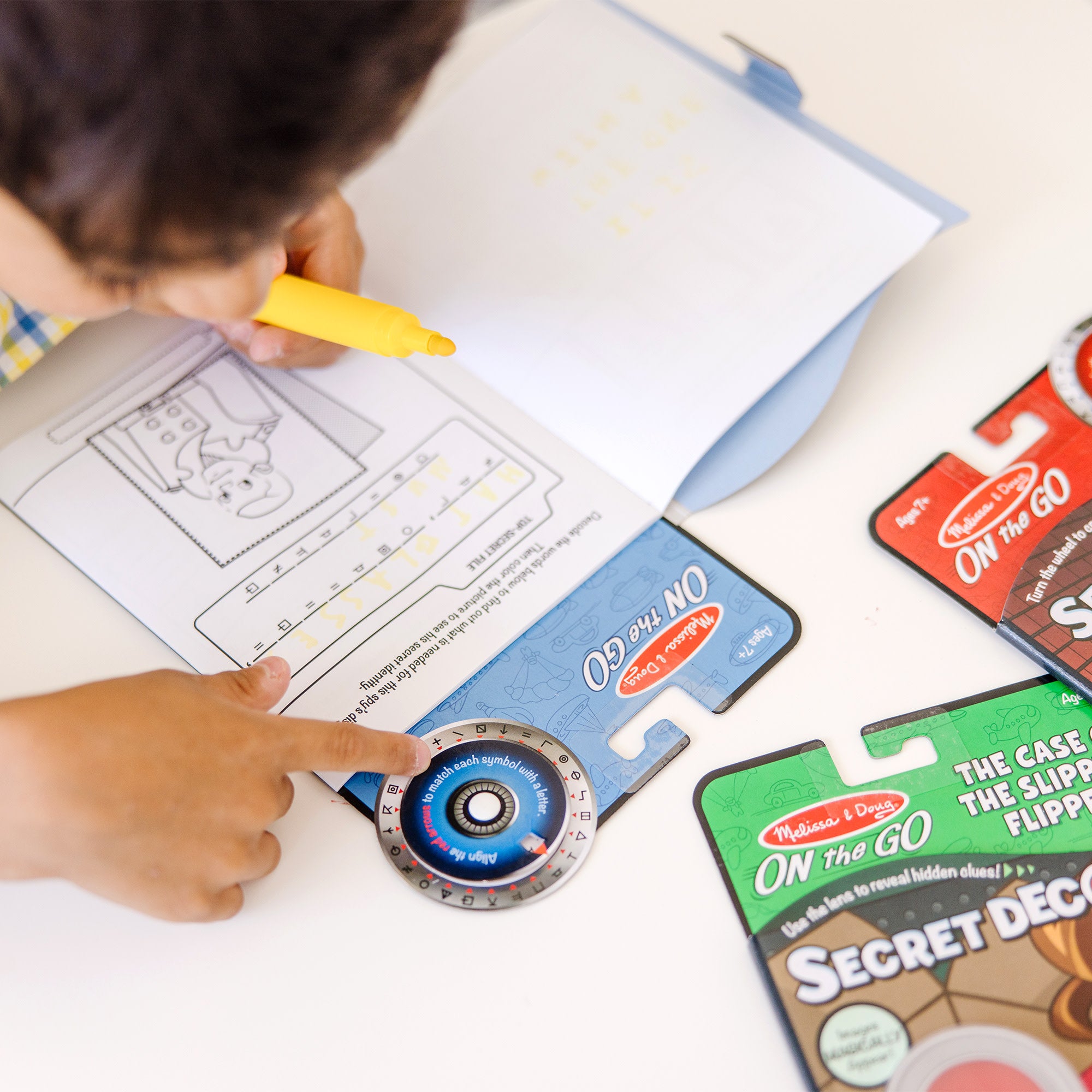 Melissa & Doug On the Go? Secret Decoder Activity Books 3-Pack: Slippery Flippers, Runaway Ruby, Game Book - Image 3